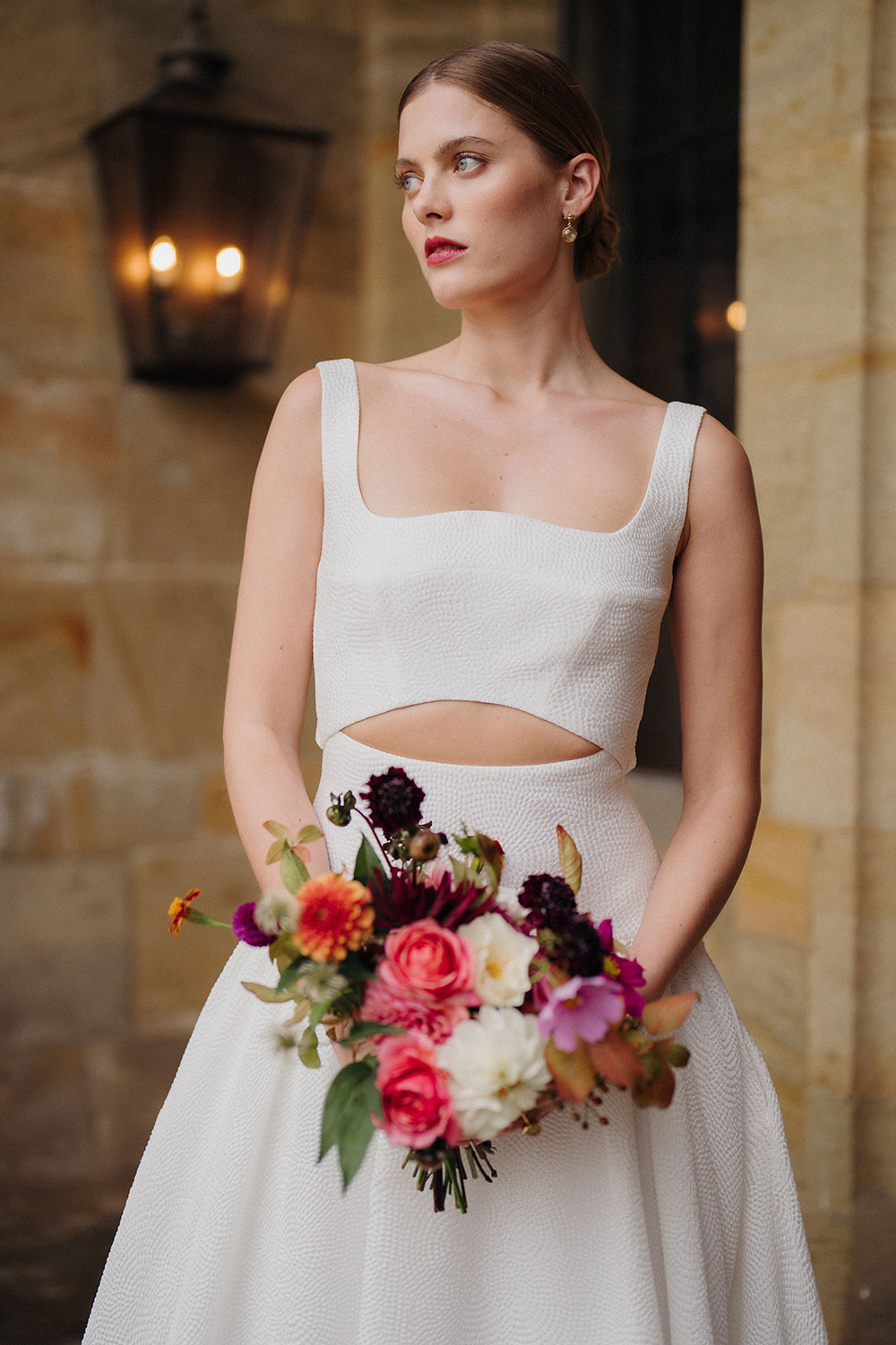 Modern wedding dress with bubble hem and cut out panels